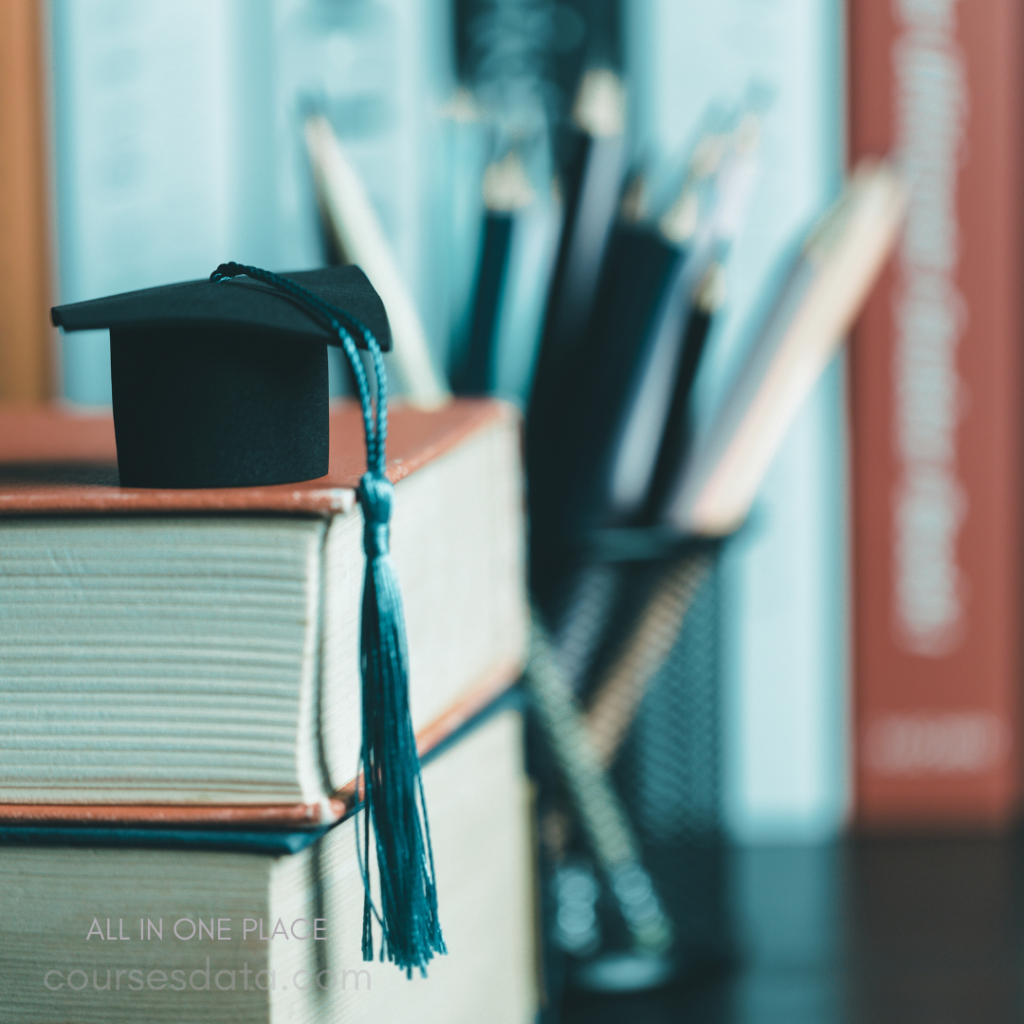 Graduation cap on stacked books.