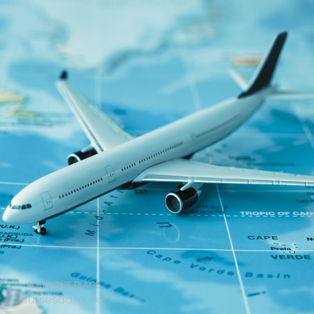 Model airplane on map. Blue ocean background. Highlighted geographical features. Airplane facing right. Focused details on aircraft.
