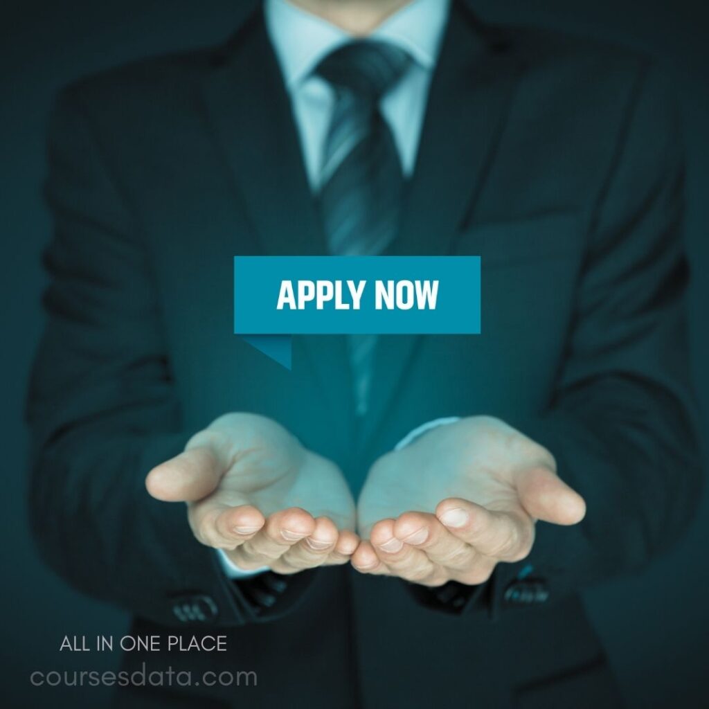 Businessman offering hands forward. Text: "APPLY NOW" highlighted. Dark background, professional attire. Website link at bottom.