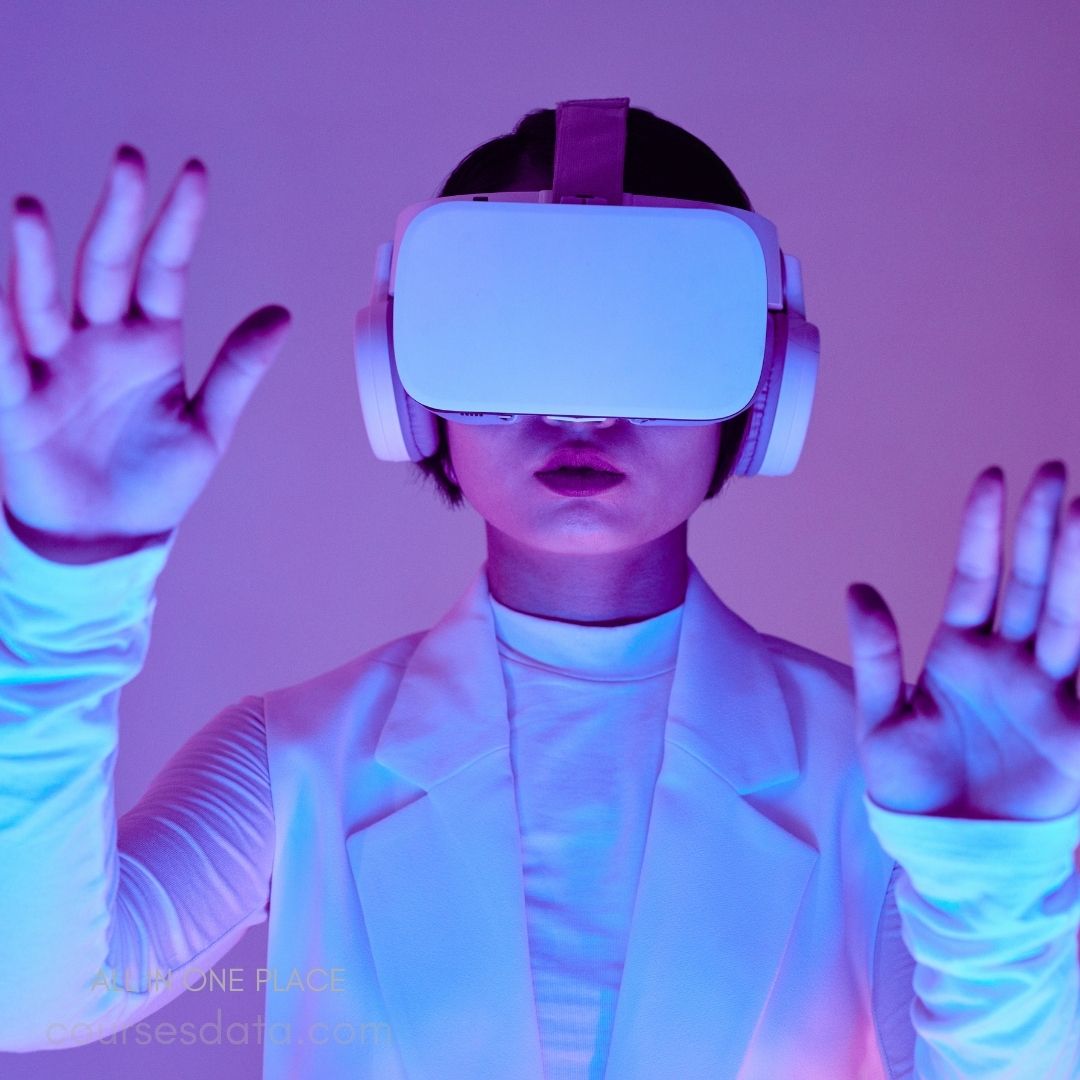 Person wearing VR headset. Hands raised in exploration. Vibrant purple and blue lighting. Futuristic attire and setting. Engaged in virtual reality experience.