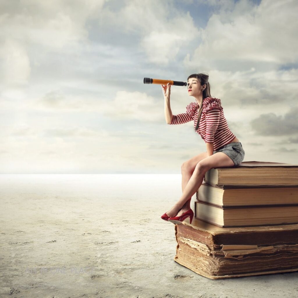 Woman using telescope, sitting. Stack of large books. Desert landscape, cloudy sky. Striped shirt, high heels.