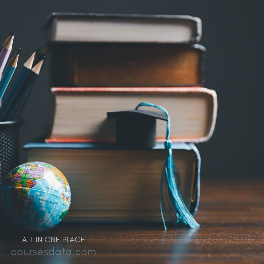 Books, globe, graduation cap, pencils.