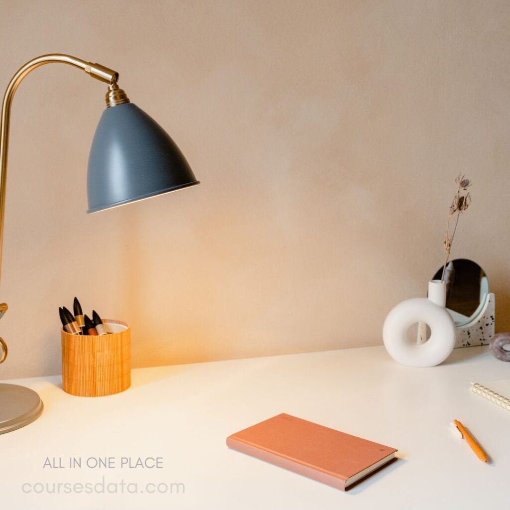 Desk with lamp and stationery.