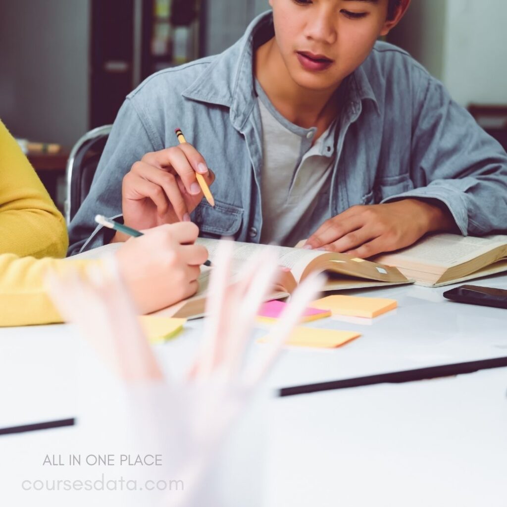 Students studying with textbooks and notes.