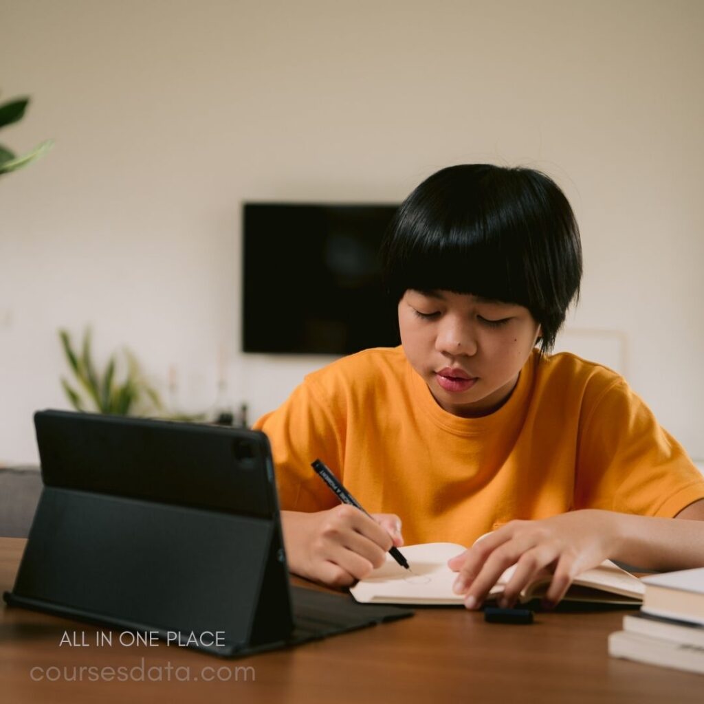 Child studying at a desk.