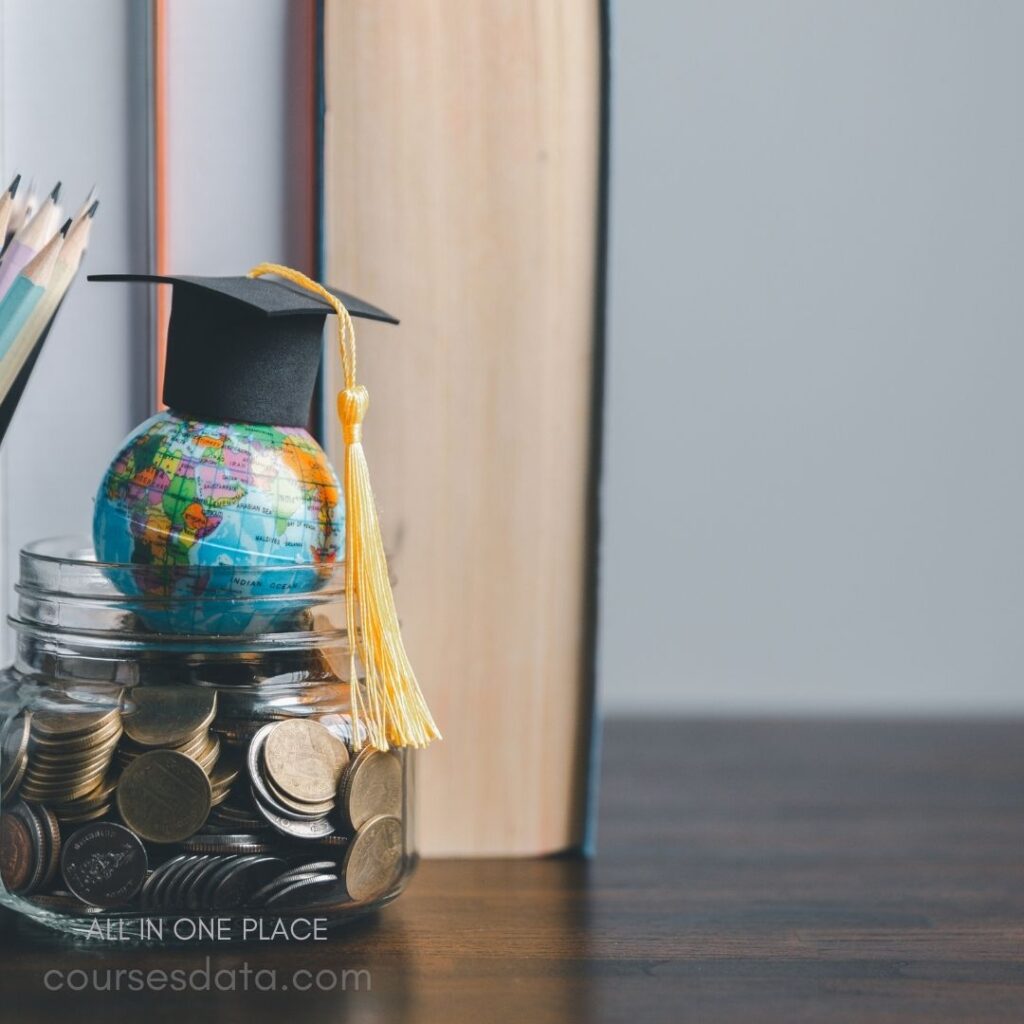 Graduation cap atop globe jar.