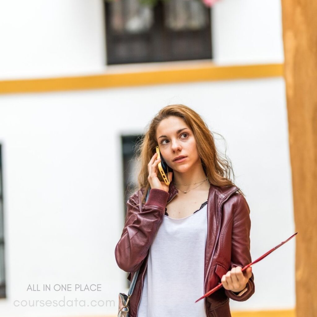 Young woman talking on phone.