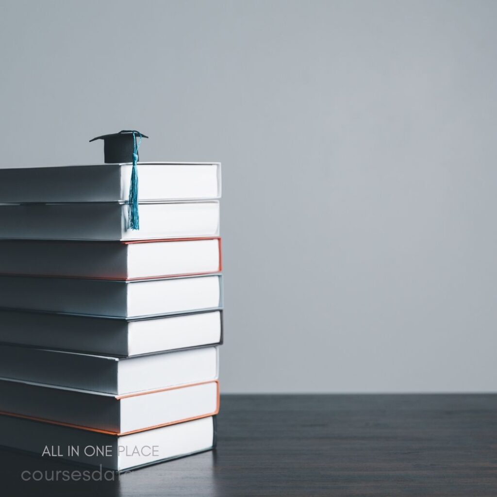 Graduation cap atop stacked books.