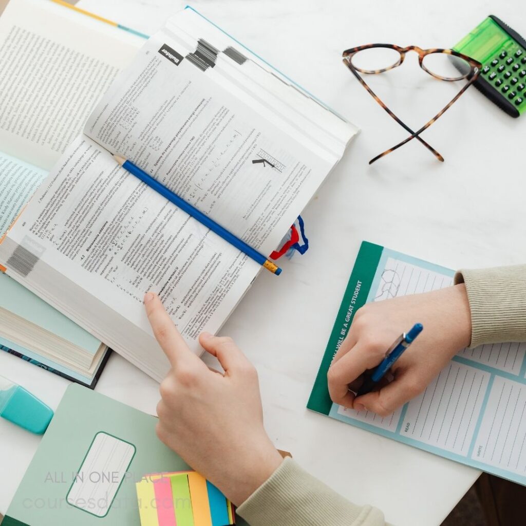 Studying with books and stationery.