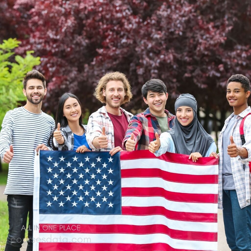 Diverse group holding American flag.