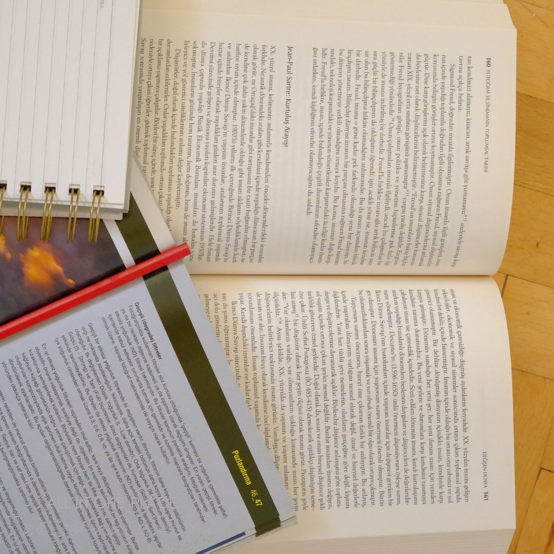 Textbooks and notebook on table.