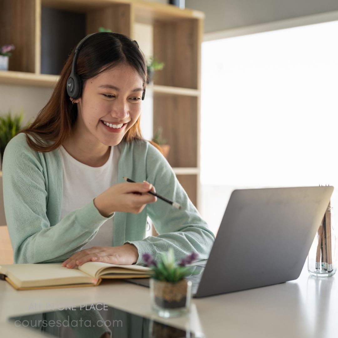 Smiling woman video conferencing online.