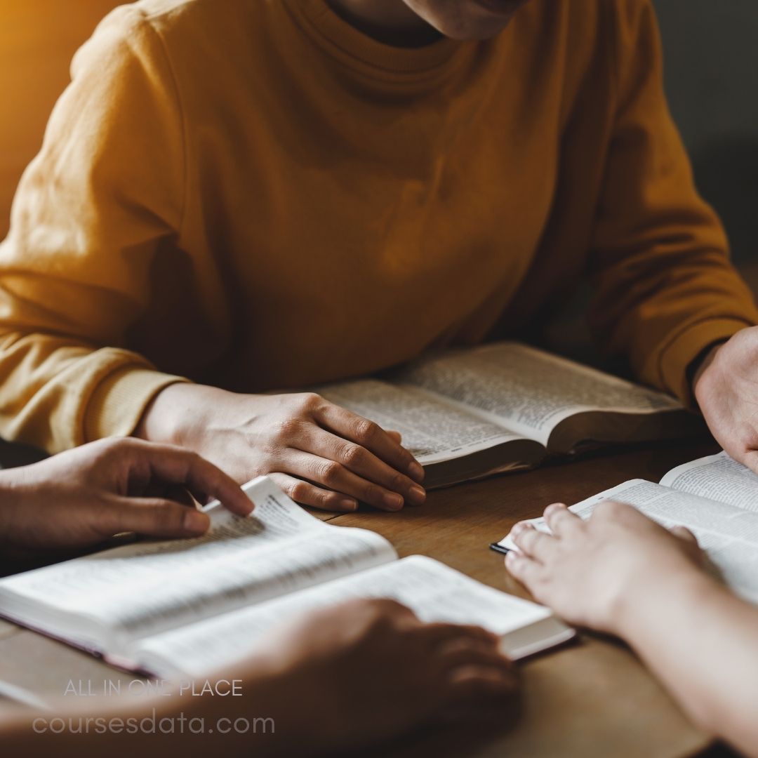 Group studying open books together.