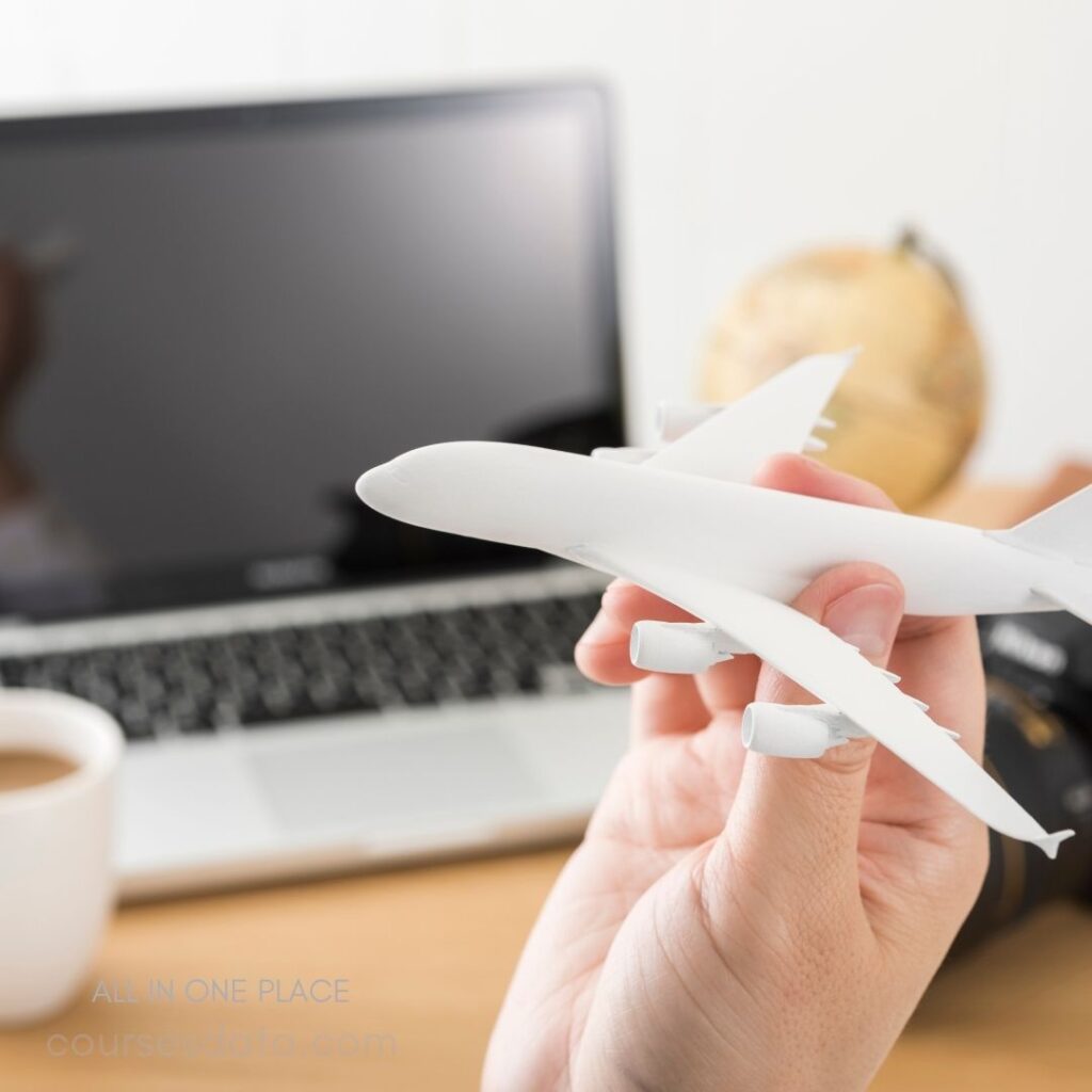 Hand holding white airplane model.