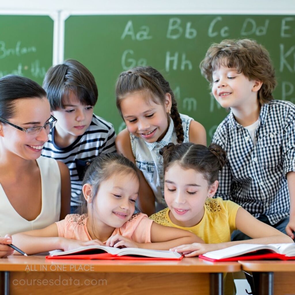 Children reading together, teacher smiling.