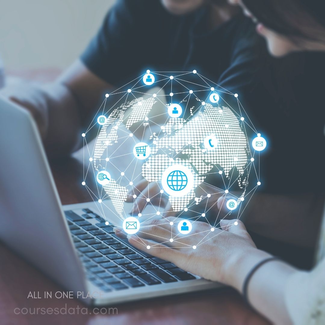 Hands using laptop with globe.