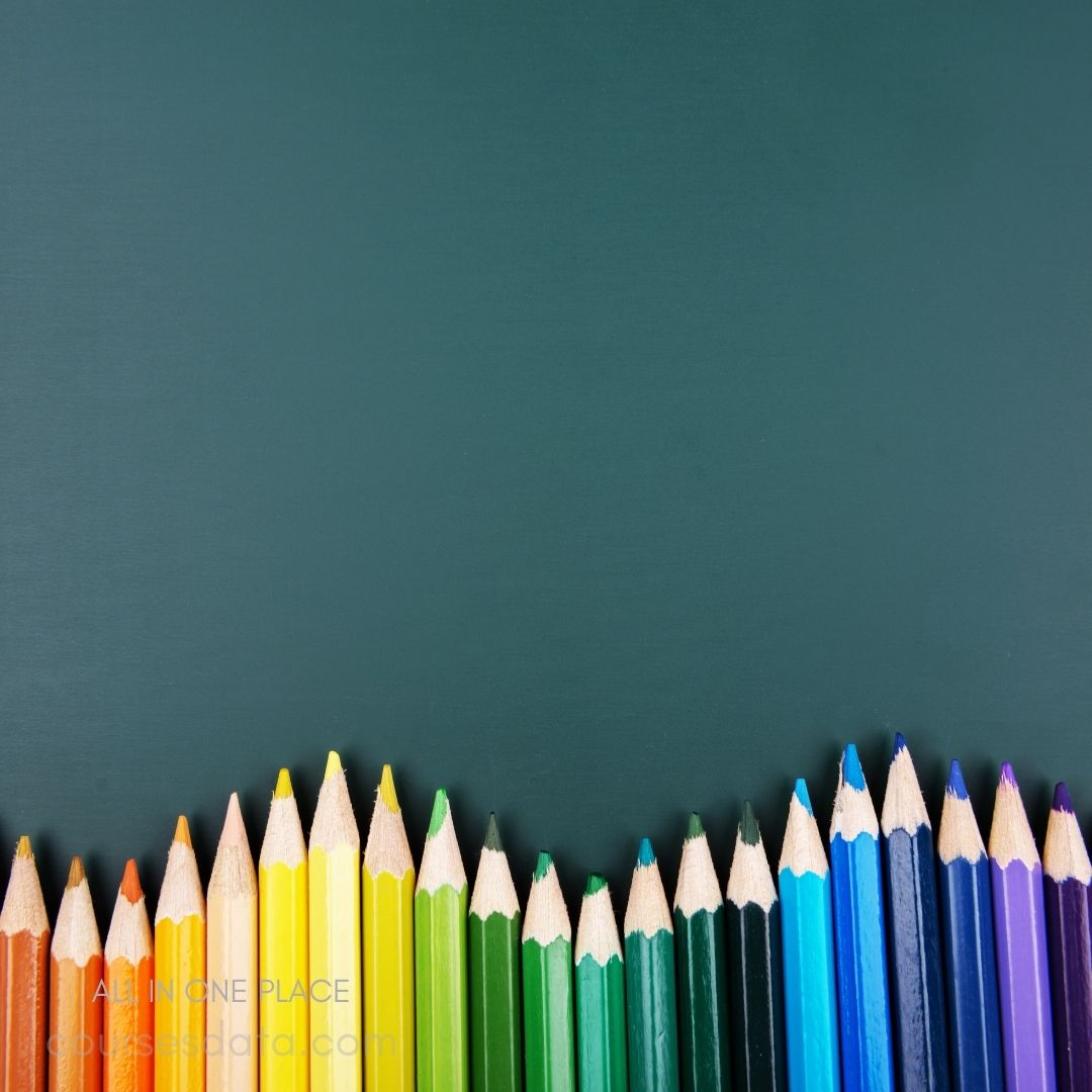 Colorful pencils on dark background.
