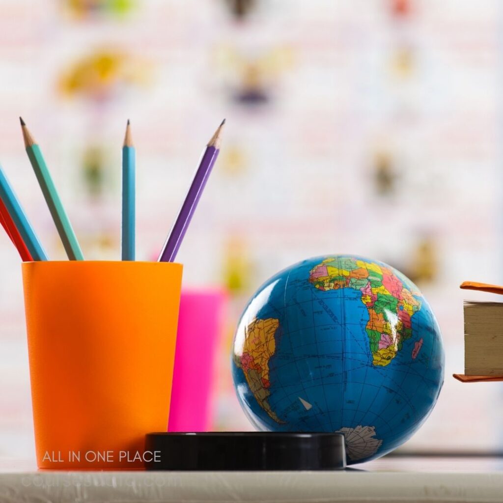 Colorful pencils and globe.