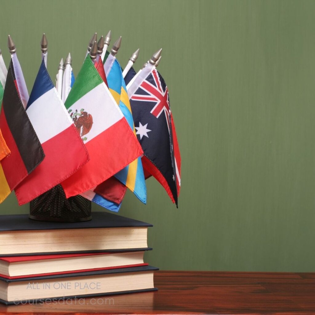 International flags on stacked books.