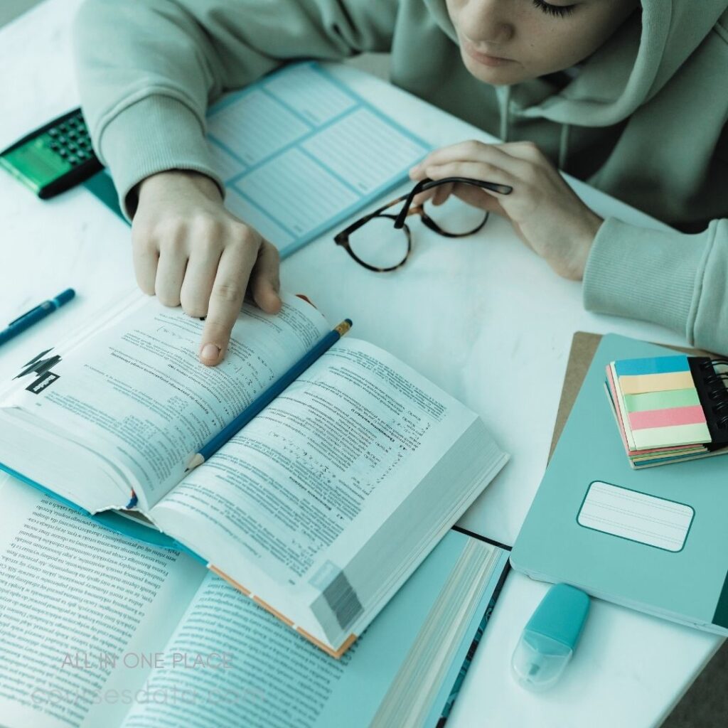 Studying with textbooks and supplies.