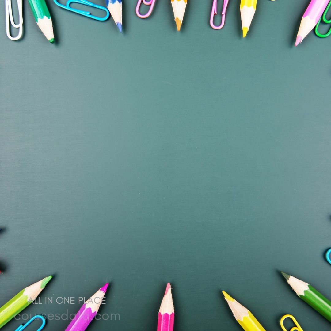 Colorful pencils and paperclips arranged.
