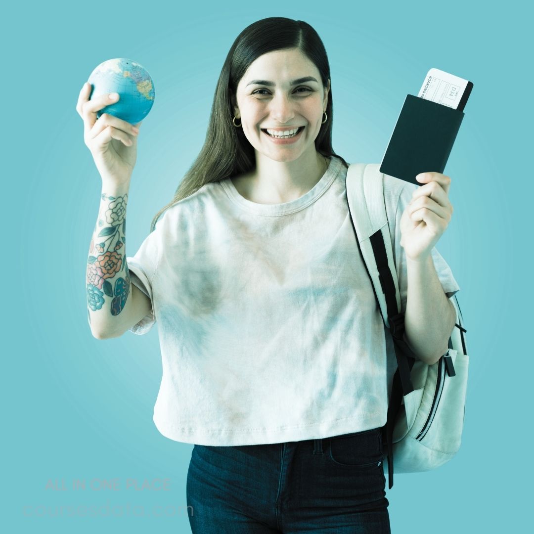 Smiling woman holding globe and passport.