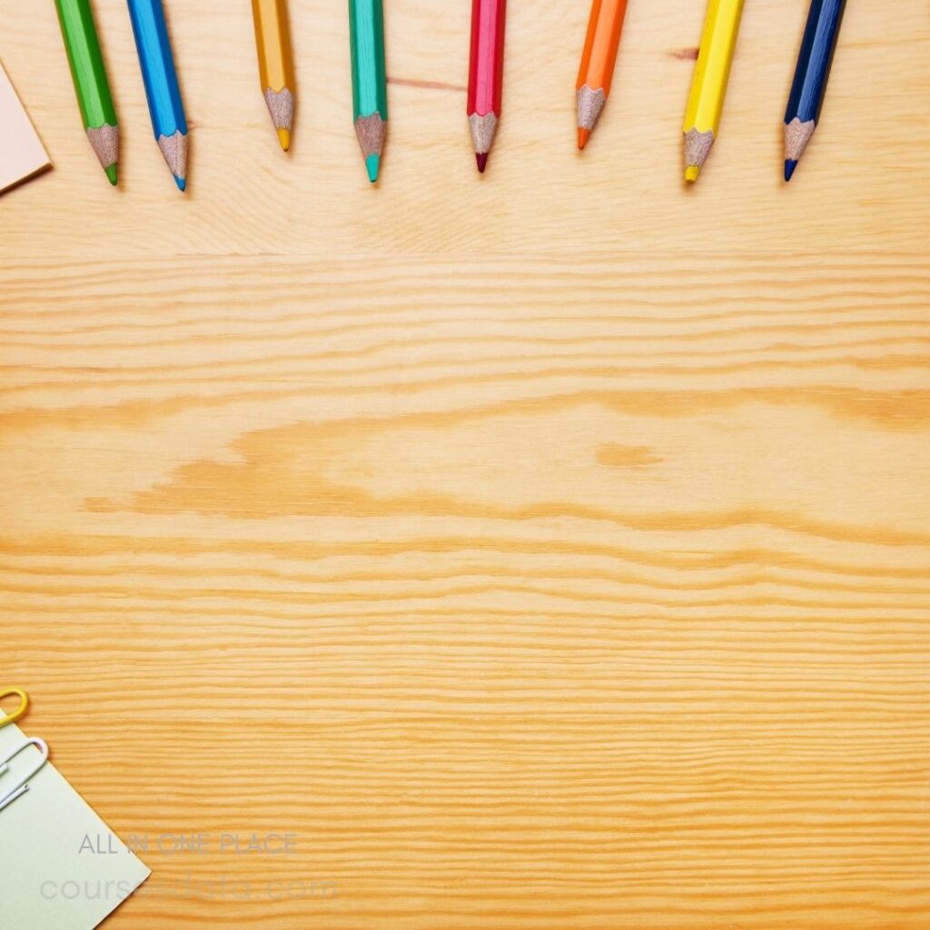 Colorful pencils on wooden surface.