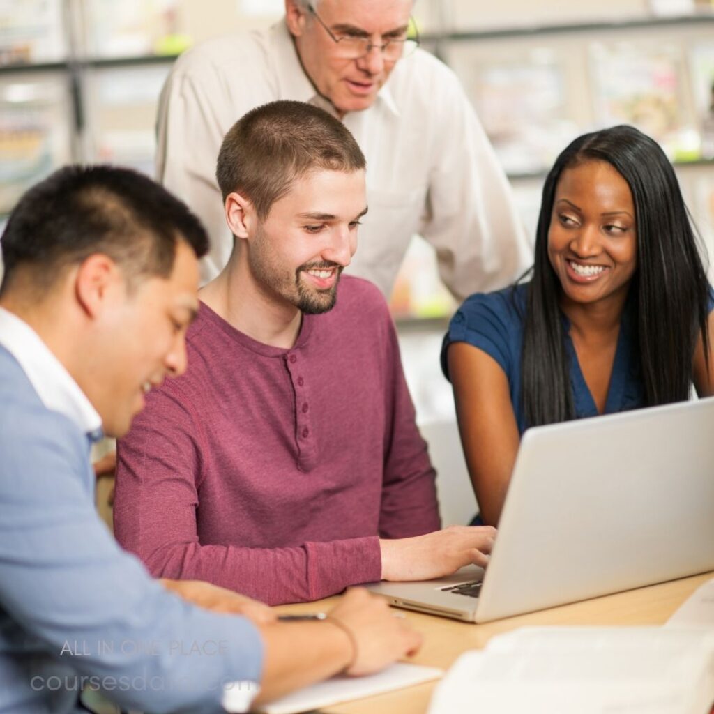 Group collaborating over laptop.