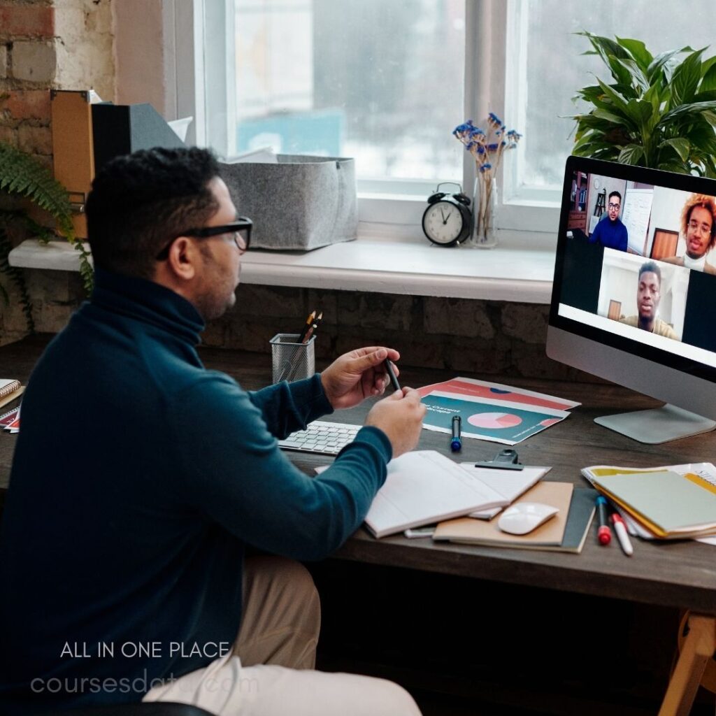 Person video conferencing on computer.