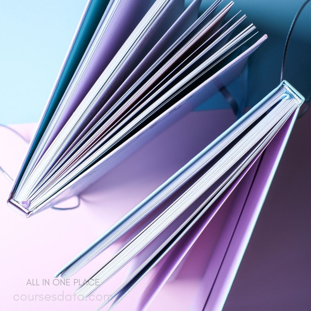 Colorful books on pastel background.