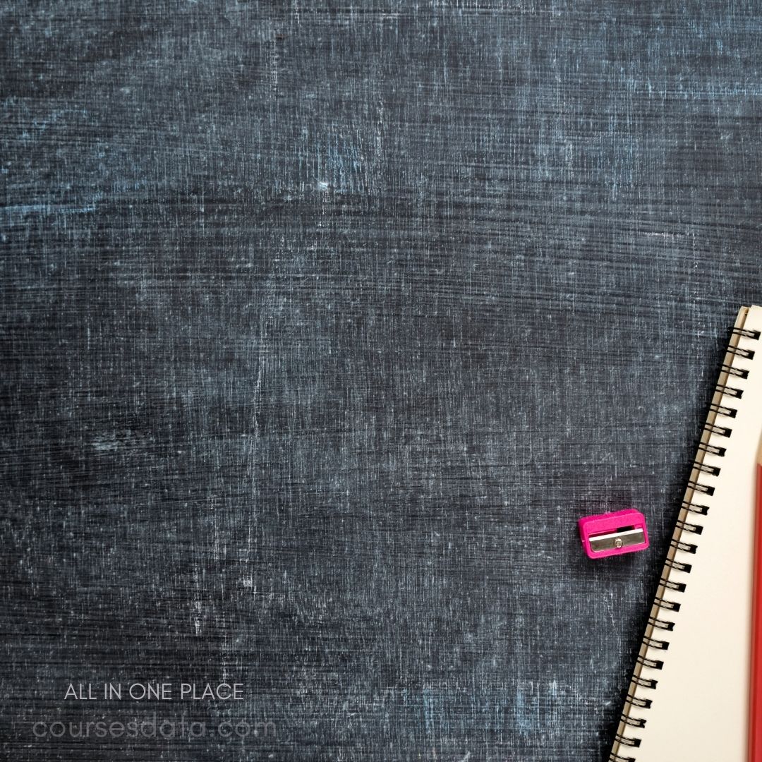 Notebook and sharpener on background.