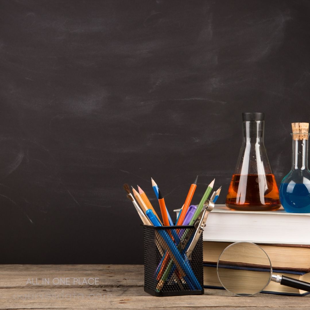 Colorful stationery on classroom desk.