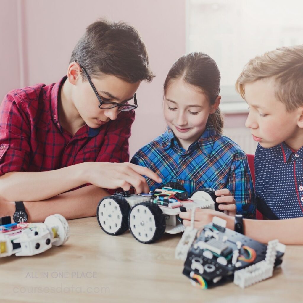 Children assembling robotics projects together.