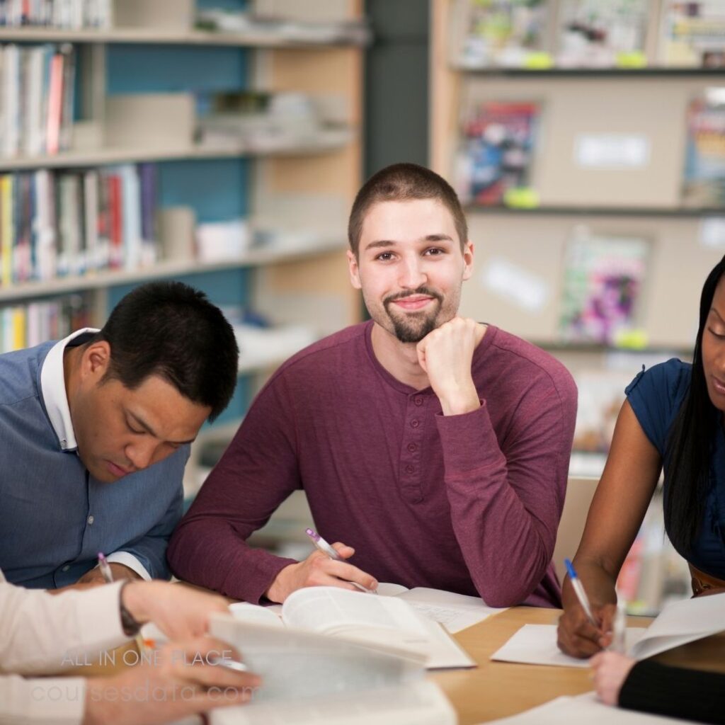 Students studying in library setting.