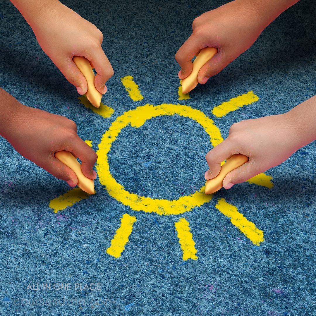 Colored hands drawing sun.