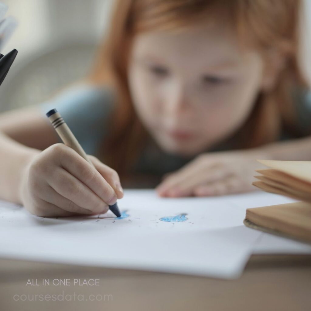 Child drawing with crayons.