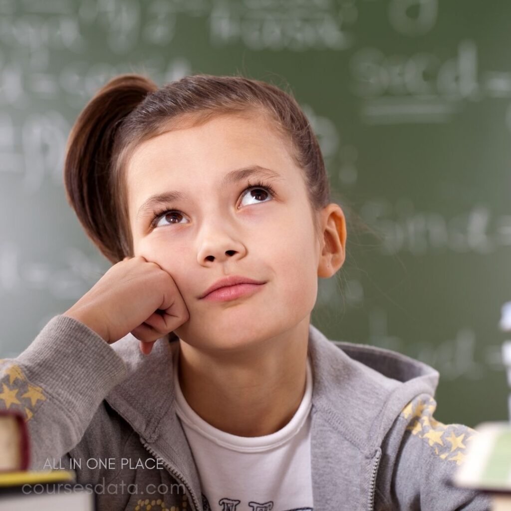 Thoughtful girl in classroom.