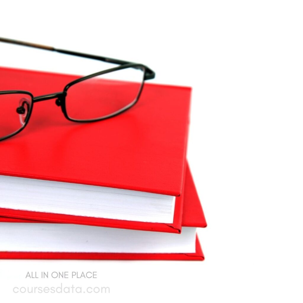 Red books with eyeglasses.