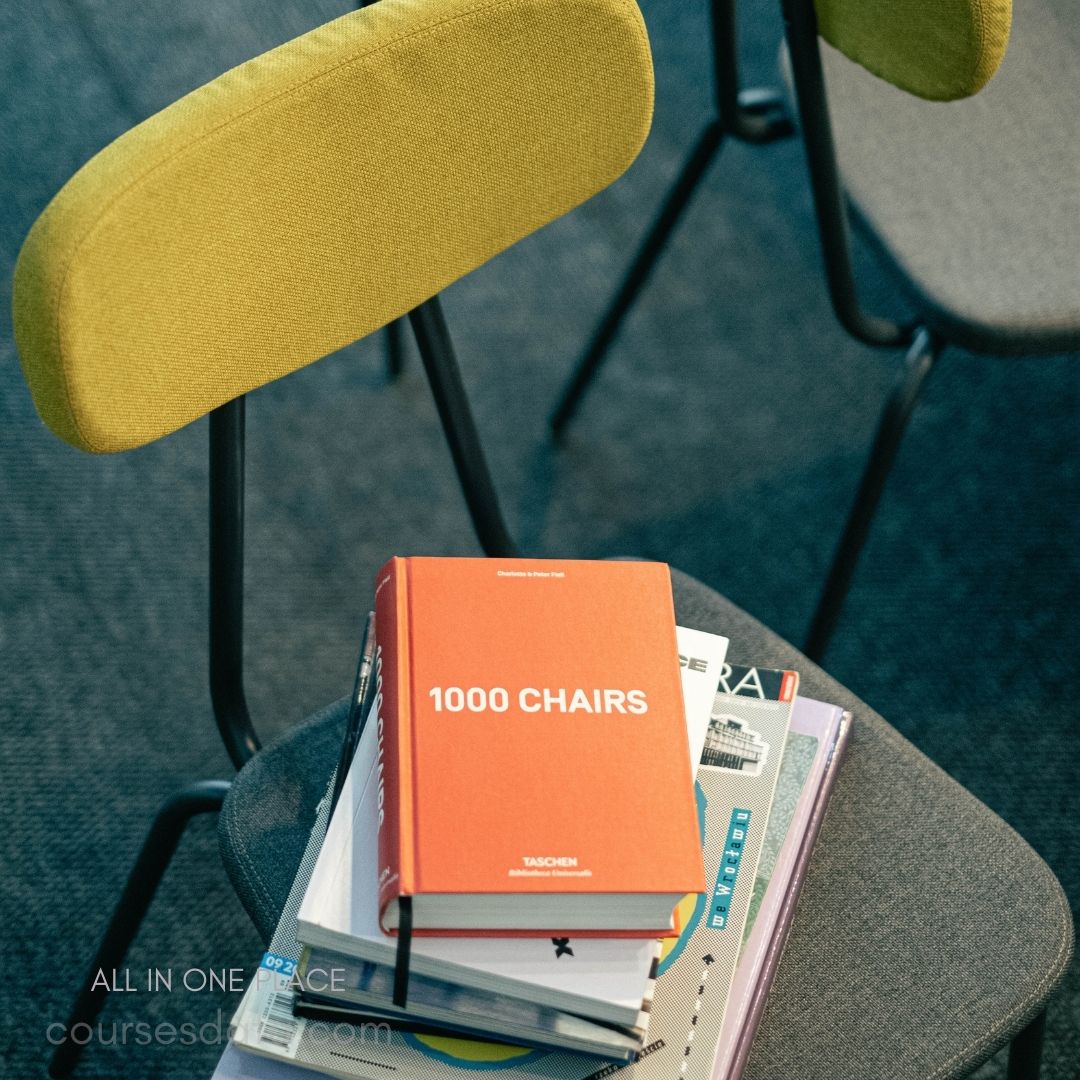 Colorful chair with stacked books.