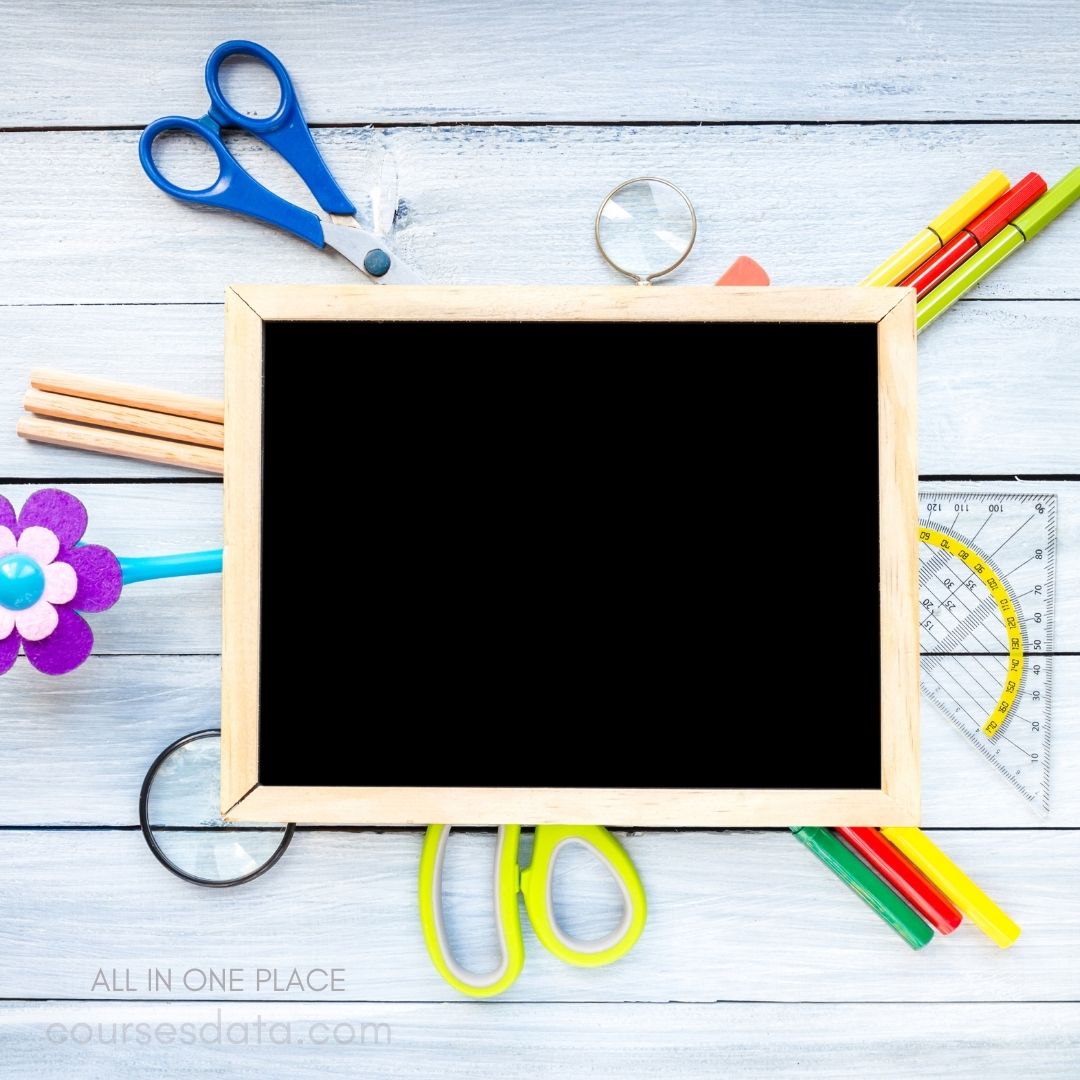 Colorful school supplies around chalkboard.
