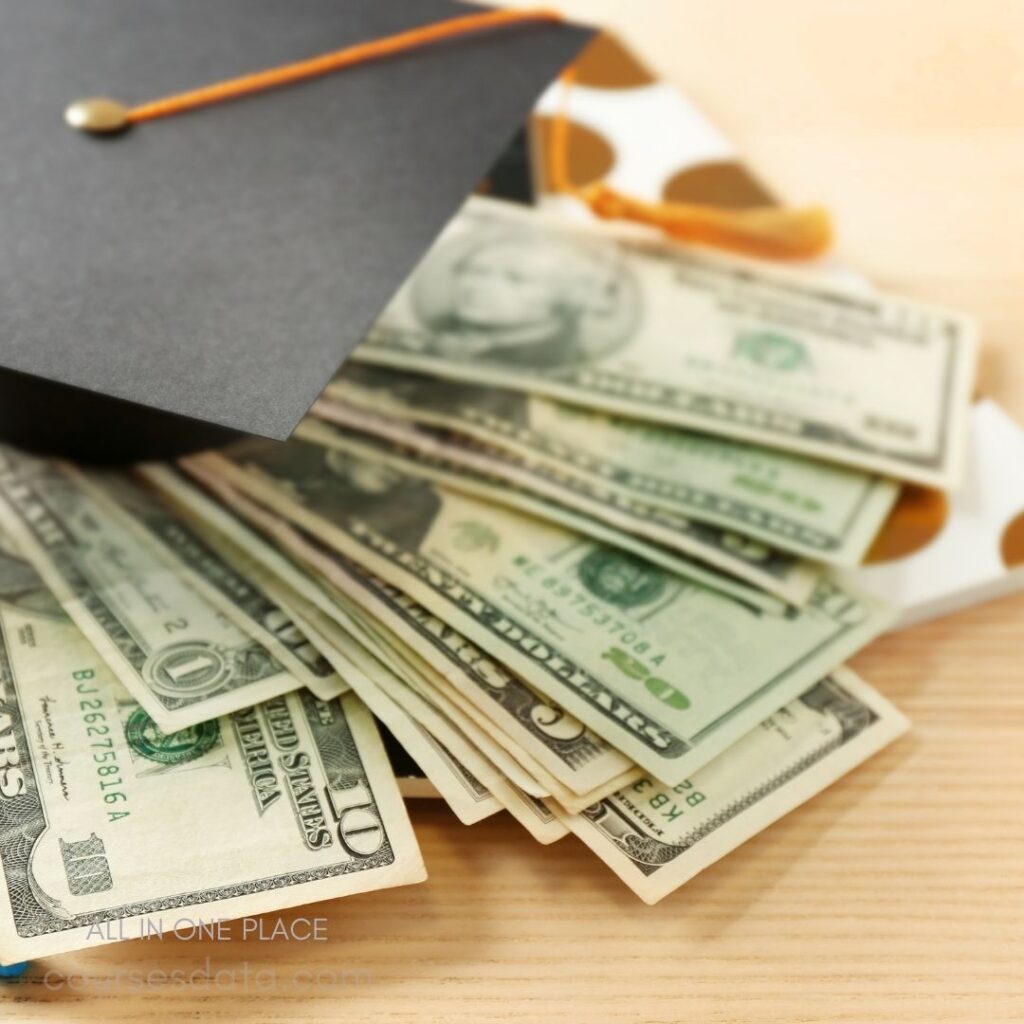 Graduation cap on cash pile.