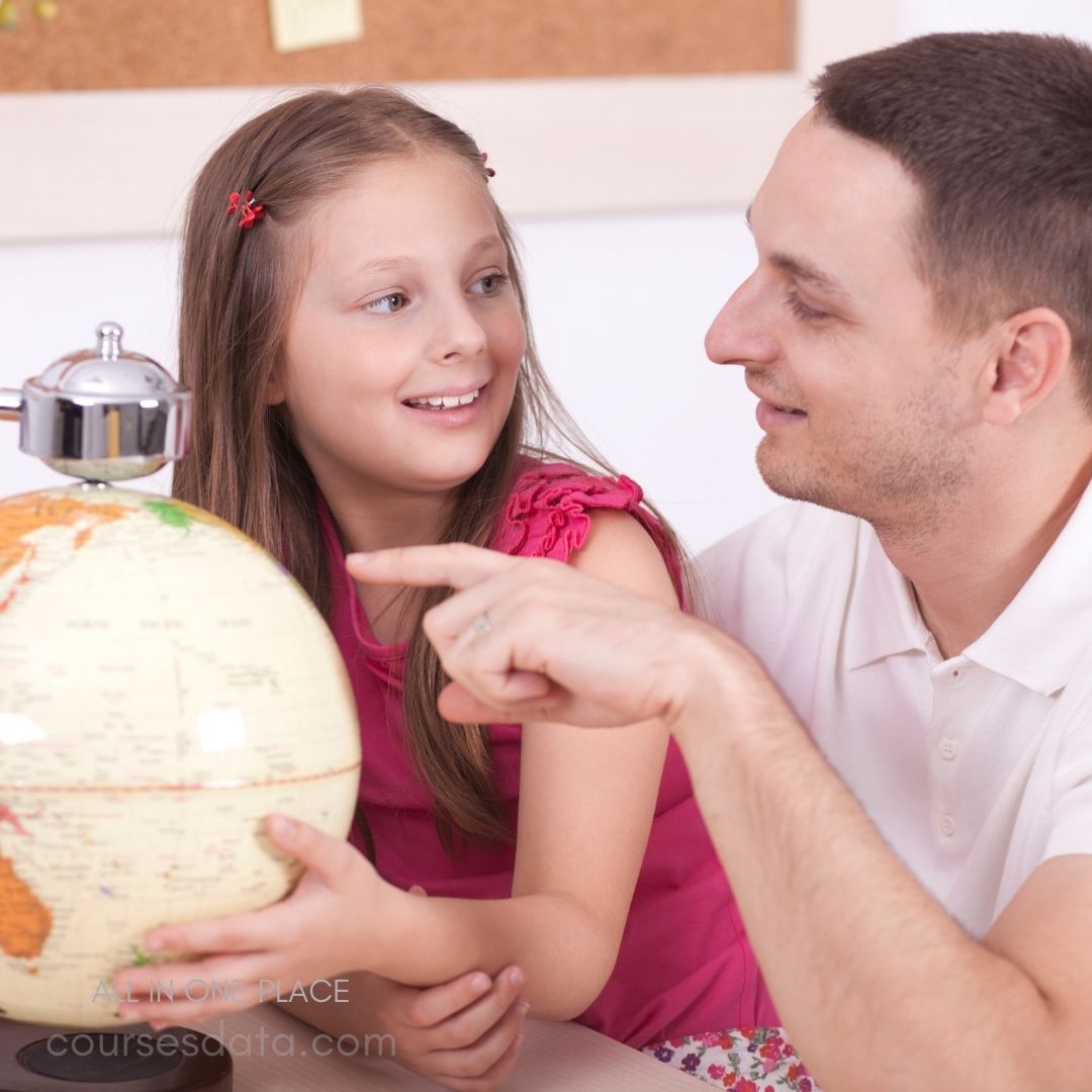 Father and daughter engaged, globe.
