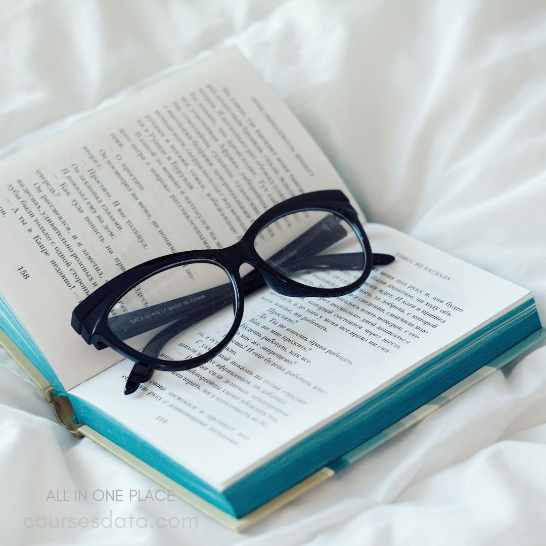 Glasses resting on open book.