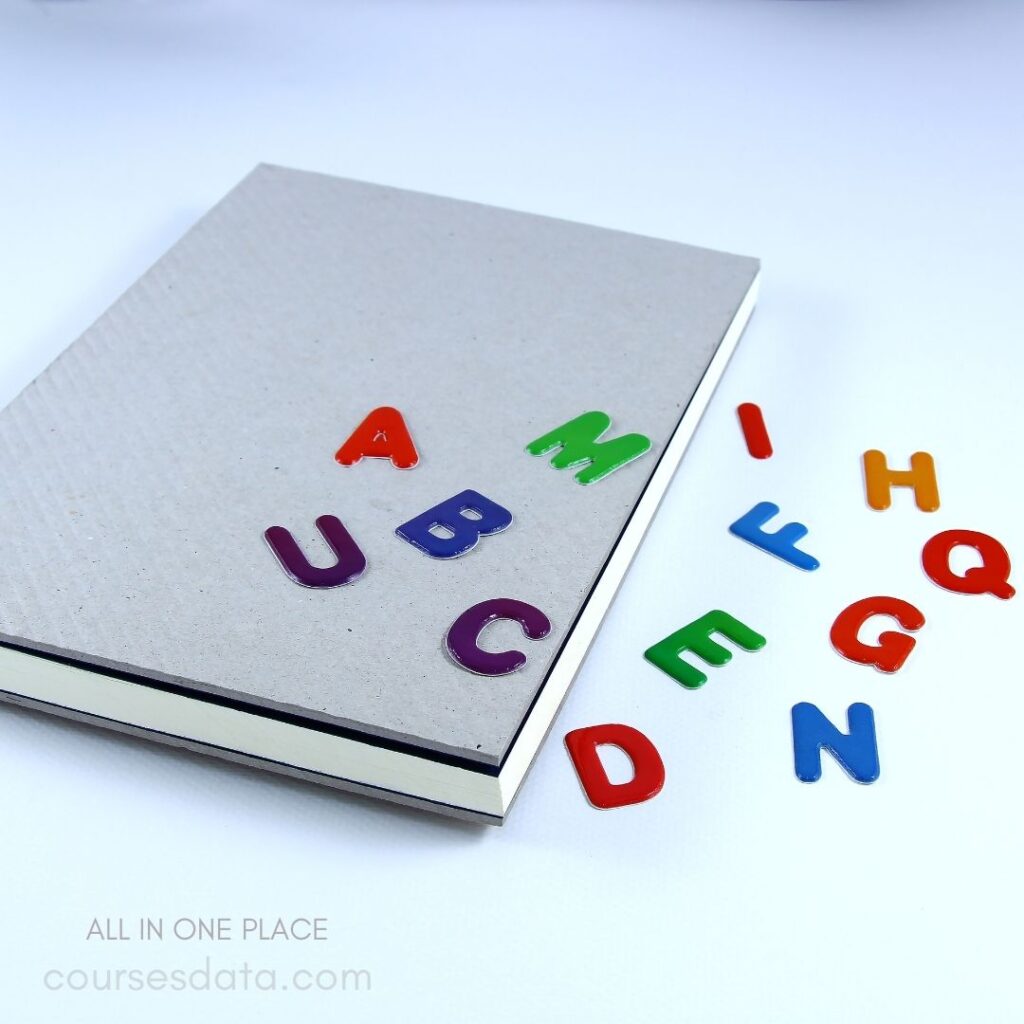 Colorful letters on a notebook.