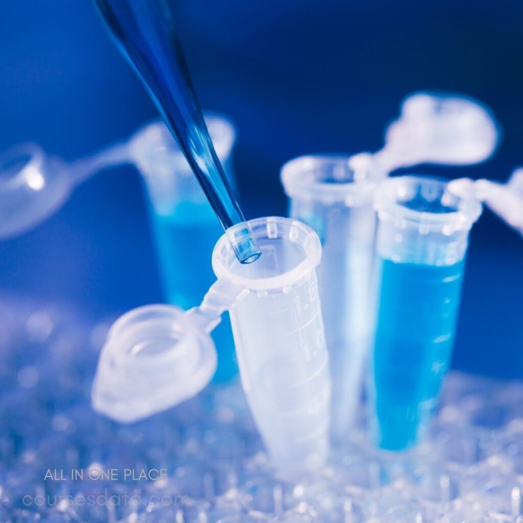 Pipette transferring blue liquid samples.