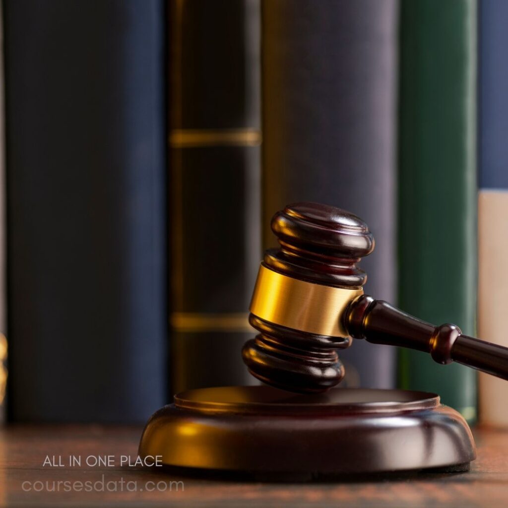 Wooden gavel on a pedestal.