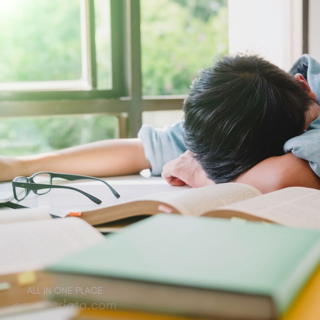 Student resting on desk.