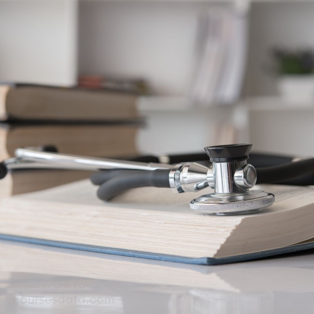 Stethoscope resting on books.