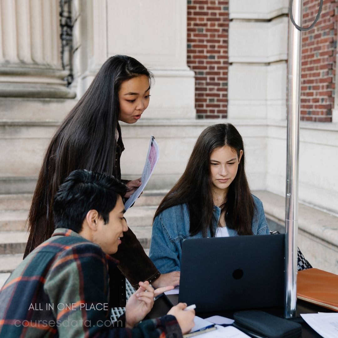 Students collaborating at a table.