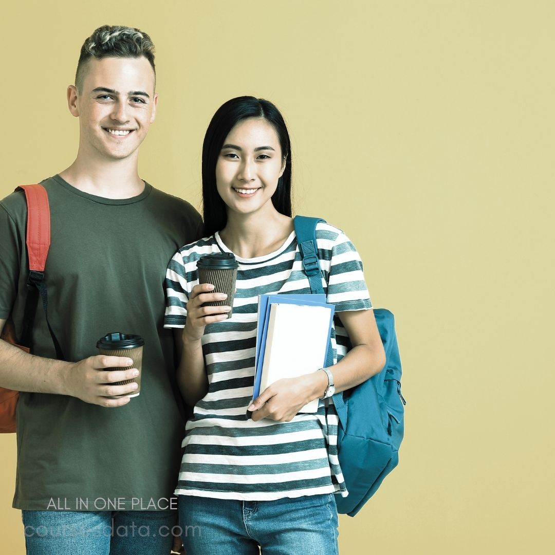 Two smiling students with coffee.